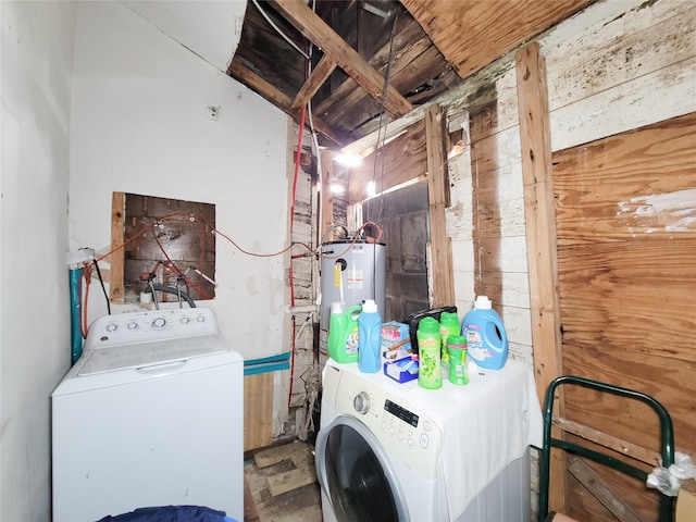 418 Bishop St, Houston, TX 77009 - laundry area with water heater and washer and dryer