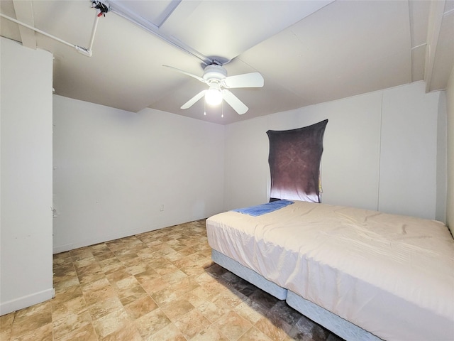 418 Bishop St, Houston, TX 77009 - bedroom with a ceiling fan, baseboards, and stone finish floors