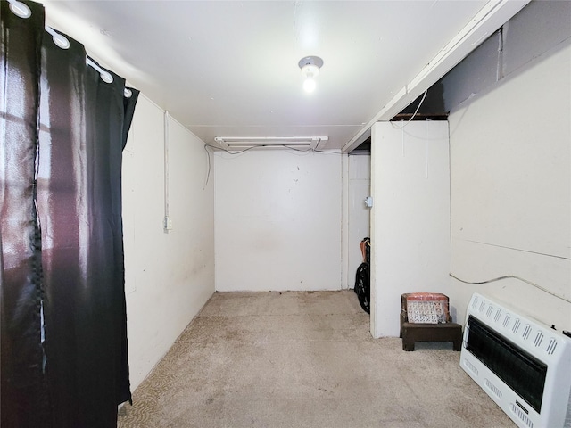 418 Bishop St, Houston, TX 77009 - finished below grade area featuring heating unit and light carpet