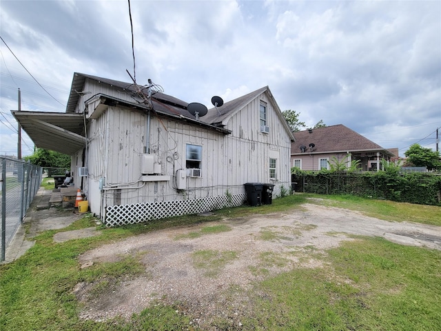 418 Bishop St, Houston, TX 77009 - rear view of house featuring cooling unit and board and batten siding