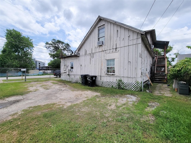 418 Bishop St, Houston, TX 77009 - view of home's exterior featuring board and batten siding and stairs