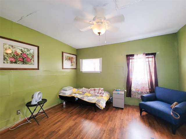 418 Bishop St, Houston, TX 77009 - bedroom featuring wood finished floors and a ceiling fan