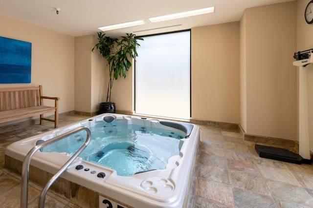 5100 San Felipe St Unit 98, Houston, TX 77056 - misc room featuring a jacuzzi and light stone finish floors