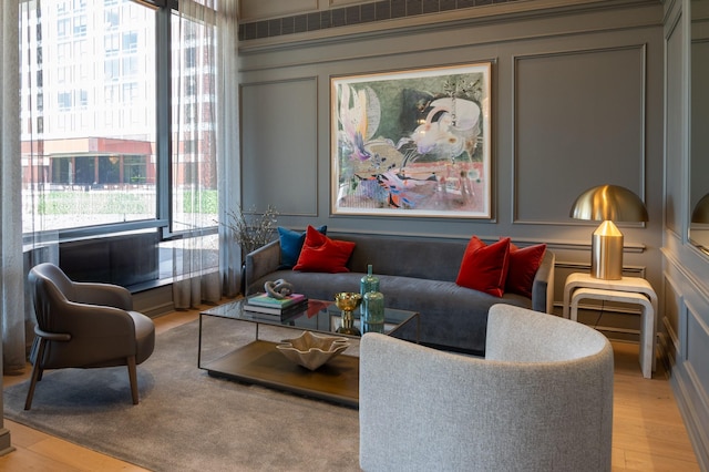 5100 San Felipe St Unit 98, Houston, TX 77056 - living room featuring a decorative wall and light wood-style floors