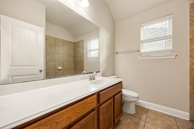 20522 Saddleback Chase Ln, Cypress, TX 77433 - bathroom with vaulted ceiling, vanity, toilet, tile patterned flooring, and baseboards