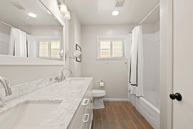 5318 Imogene St, Houston, TX 77096 - full bath featuring double vanity, plenty of natural light, toilet, baseboards, and recessed lighting