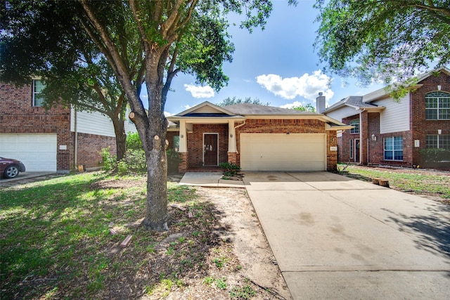 5811 Laramie River Ct, Katy, TX 77449 - view of front of house with a chimney, a garage, driveway, and brick siding