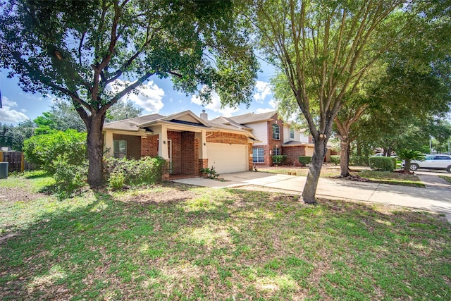 5811 Laramie River Ct, Katy, TX 77449 - view of front of home with brick siding, driveway, an attached garage, and cooling unit