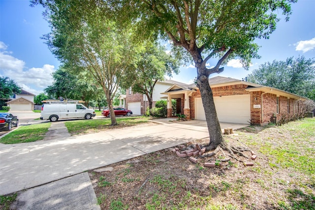 5811 Laramie River Ct, Katy, TX 77449 - view of front of property featuring brick siding, an attached garage, and driveway