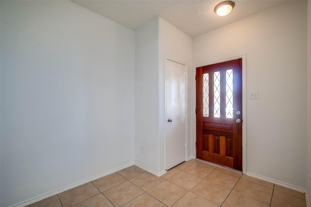 5811 Laramie River Ct, Katy, TX 77449 - entryway featuring light tile patterned floors and baseboards
