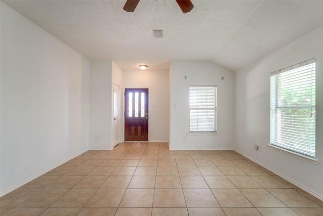5811 Laramie River Ct, Katy, TX 77449 - entrance foyer with a ceiling fan, light tile patterned floors, lofted ceiling, and baseboards