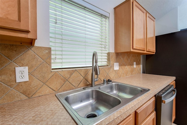 5811 Laramie River Ct, Katy, TX 77449 - kitchen featuring a sink, backsplash, stainless steel appliances, and light countertops