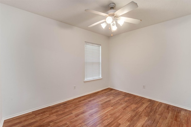 5811 Laramie River Ct, Katy, TX 77449 - spare room featuring light wood finished floors, baseboards, and ceiling fan