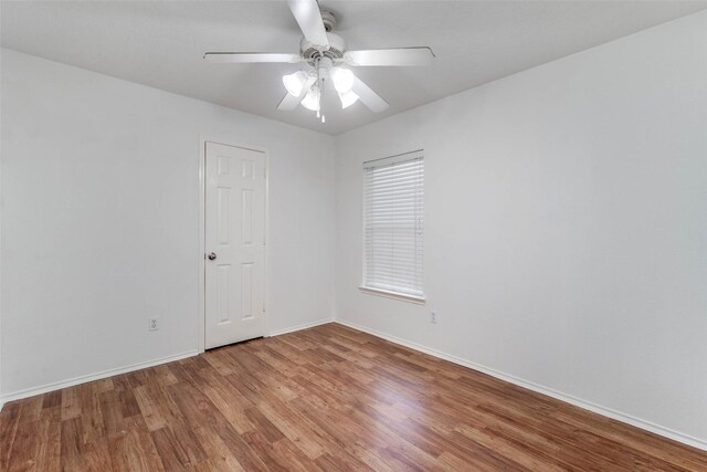 5811 Laramie River Ct, Katy, TX 77449 - spare room featuring wood finished floors, baseboards, and a ceiling fan