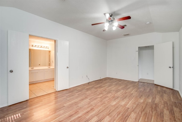 5811 Laramie River Ct, Katy, TX 77449 - unfurnished bedroom featuring light wood-type flooring, ensuite bathroom, baseboards, and ceiling fan