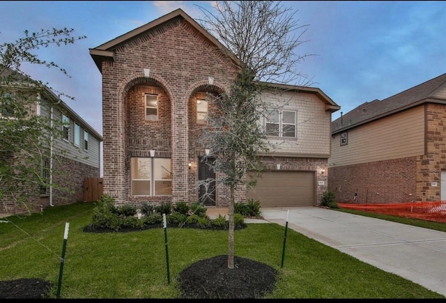 28430 Buffalo Fork Ln, Katy, TX 77494 - view of front of home featuring brick siding, a garage, driveway, and a front yard