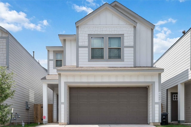 4426 Ibiza Ln, Houston, TX 77045 - view of front of property with board and batten siding, an attached garage, and driveway