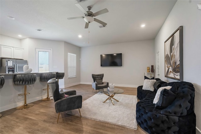 4426 Ibiza Ln, Houston, TX 77045 - living room featuring wood finished floors, a ceiling fan, and recessed lighting