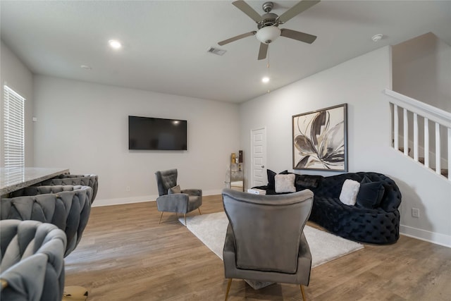4426 Ibiza Ln, Houston, TX 77045 - living room with light wood-style flooring, a ceiling fan, and recessed lighting