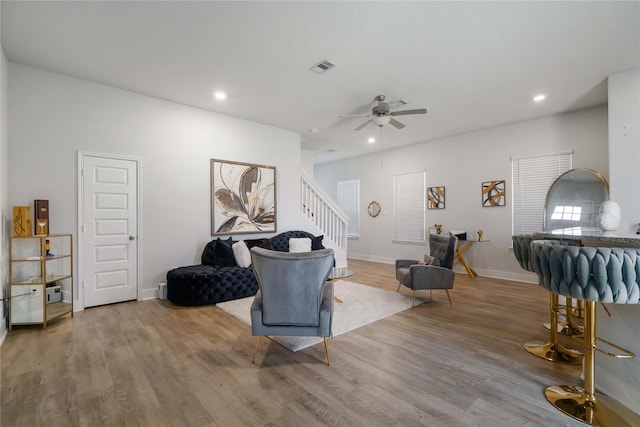 4426 Ibiza Ln, Houston, TX 77045 - living room featuring stairs, wood finished floors, recessed lighting, and ceiling fan