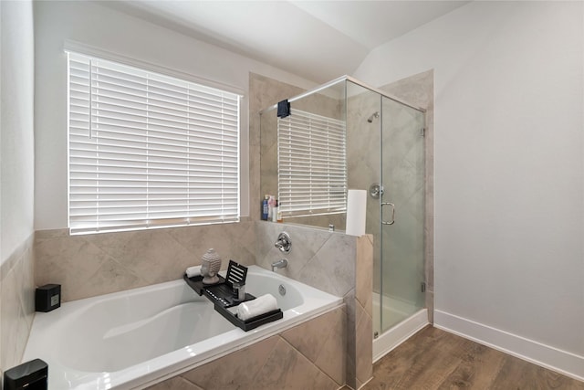 4426 Ibiza Ln, Houston, TX 77045 - full bathroom with a stall shower, a bath, and wood finished floors