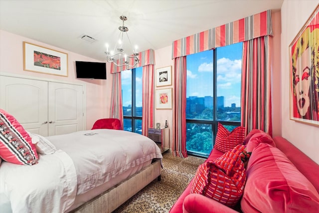 511 S Post Oak Ln Unit 6D, Houston, TX 77056 - carpeted bedroom featuring a chandelier