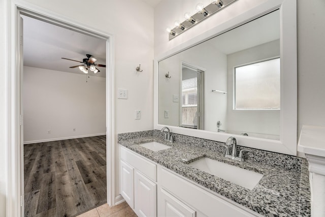 16906 Shoal Park Dr, Cypress, TX 77429 - full bathroom featuring ceiling fan, double vanity, and wood finished floors