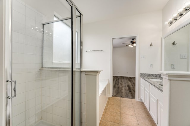 16906 Shoal Park Dr, Cypress, TX 77429 - full bathroom featuring vanity, a stall shower, ceiling fan, tile patterned flooring, and a bath