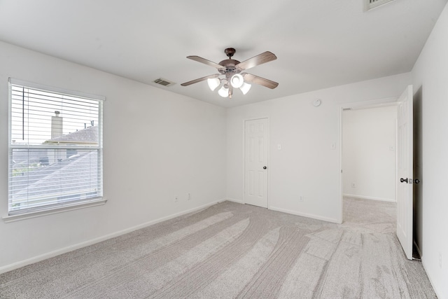 16906 Shoal Park Dr, Cypress, TX 77429 - unfurnished bedroom featuring light carpet, baseboards, a ceiling fan, and a closet