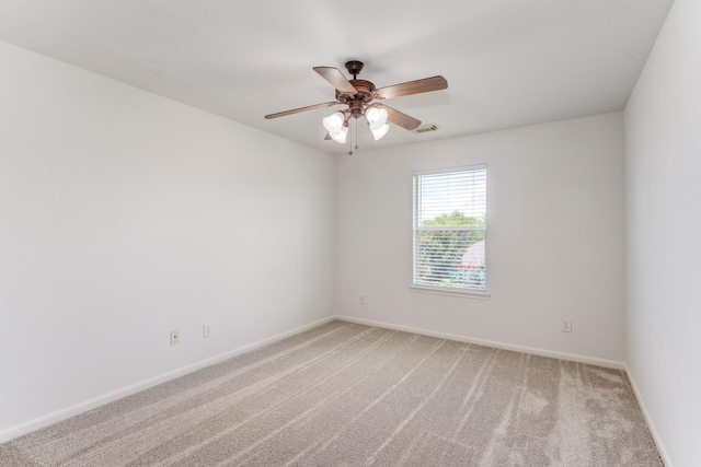 16906 Shoal Park Dr, Cypress, TX 77429 - empty room featuring light carpet, a ceiling fan, and baseboards
