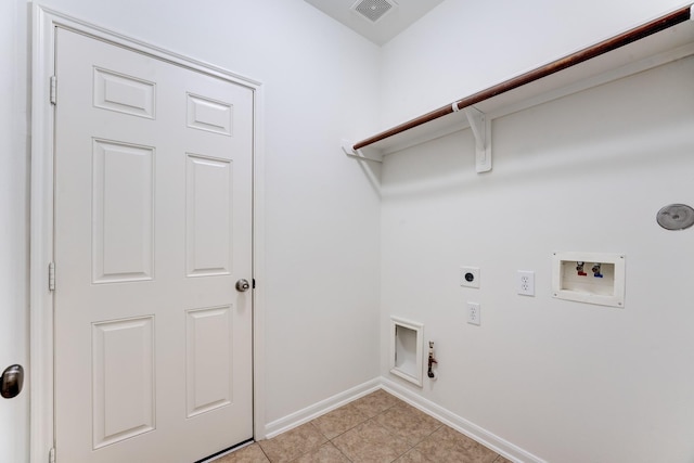 16906 Shoal Park Dr, Cypress, TX 77429 - washroom featuring hookup for an electric dryer, gas dryer hookup, hookup for a washing machine, baseboards, and light tile patterned floors