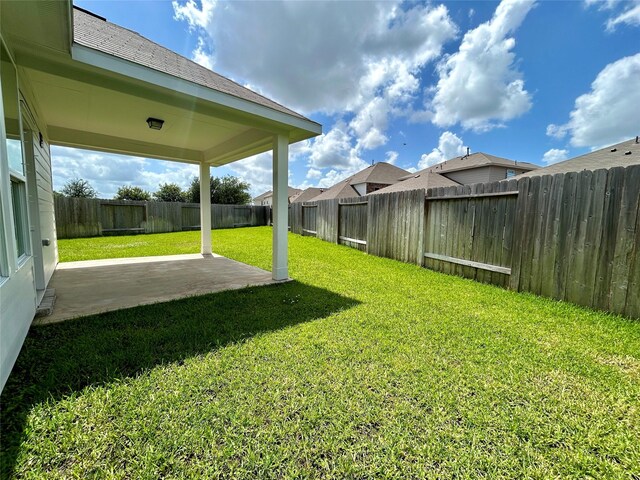 7 Riverwood Circle Ct, Angleton, TX 77515 - view of yard with a patio