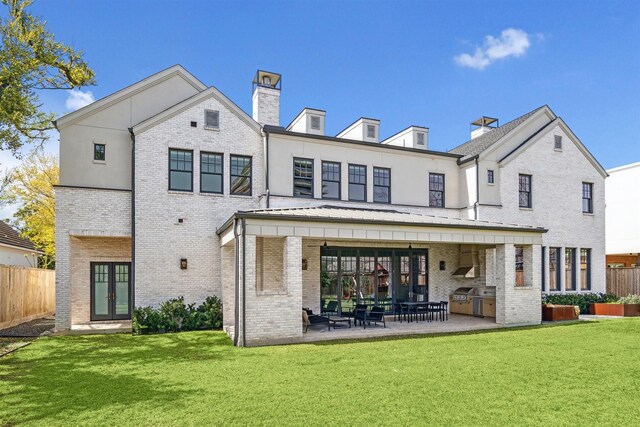 2023 Drexel Dr, Houston, TX 77027 - back of property featuring french doors, brick siding, and a patio