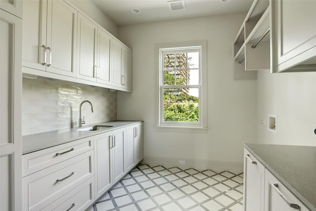2023 Drexel Dr, Houston, TX 77027 - laundry room with cabinet space, hookup for a washing machine, and baseboards