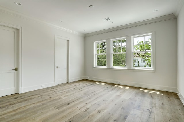 2023 Drexel Dr, Houston, TX 77027 - spare room featuring crown molding, light wood-style flooring, and baseboards