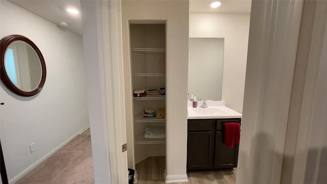 21138 Titian Dr, Magnolia, TX 77355 - bathroom with vanity and baseboards