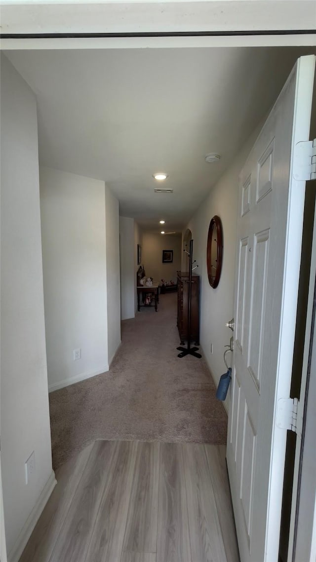21138 Titian Dr, Magnolia, TX 77355 - hallway featuring light wood-style flooring, recessed lighting, and baseboards