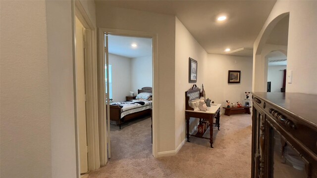 21138 Titian Dr, Magnolia, TX 77355 - corridor with light colored carpet, arched walkways, recessed lighting, and baseboards