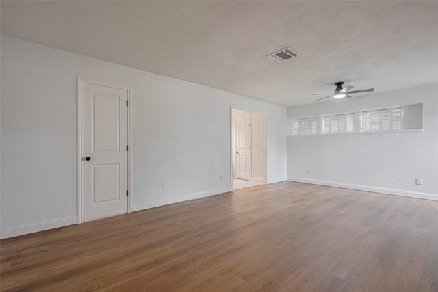 8014 Wray Ct, Houston, TX 77088 - spare room with ceiling fan, wood finished floors, and baseboards