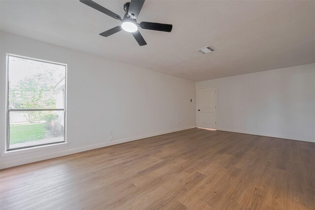 8014 Wray Ct, Houston, TX 77088 - unfurnished room featuring wood finished floors, ceiling fan, and baseboards