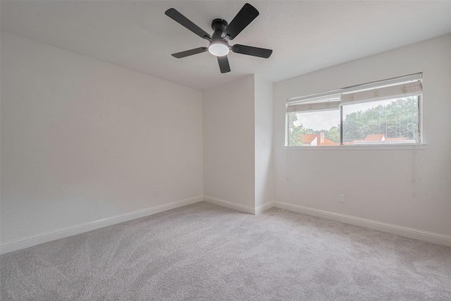 8014 Wray Ct, Houston, TX 77088 - unfurnished room featuring light colored carpet, baseboards, and a ceiling fan