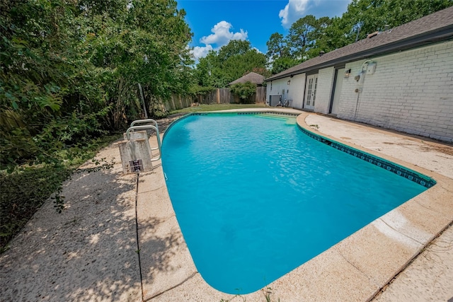 19467 Enchanted Stream Dr, Spring, TX 77388 - view of pool with a fenced backyard, a patio, and view of wooded area
