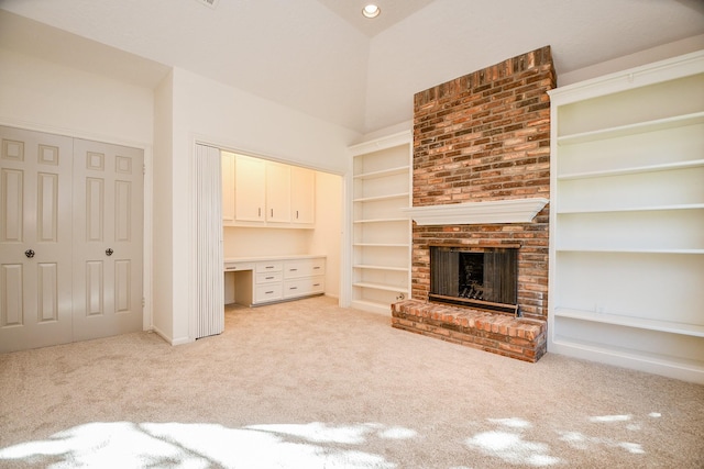 6014 Franz Ct, Katy, TX 77493 - unfurnished living room with light carpet, a fireplace, a high ceiling, built in shelves, and baseboards