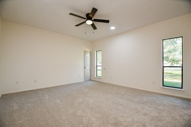 6014 Franz Ct, Katy, TX 77493 - empty room featuring a ceiling fan, light carpet, baseboards, and recessed lighting