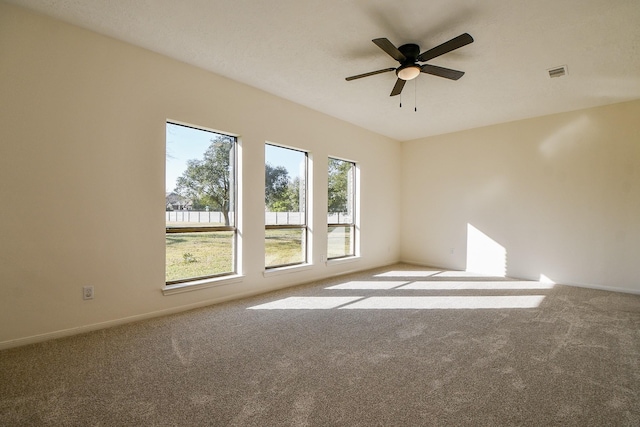 6014 Franz Ct, Katy, TX 77493 - empty room with carpet flooring, a ceiling fan, and baseboards