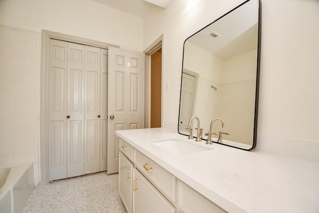 6014 Franz Ct, Katy, TX 77493 - full bathroom featuring vanity, a closet, speckled floor, and shower / washtub combination