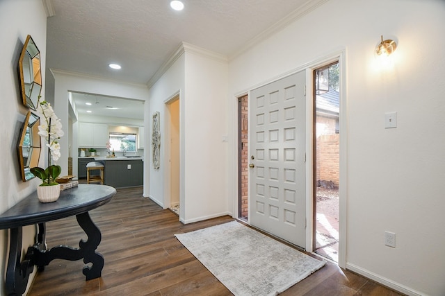 6014 Franz Ct, Katy, TX 77493 - foyer entrance with crown molding, dark wood-type flooring, baseboards, and recessed lighting