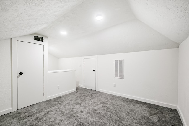 150 Squires Bnd, Stafford, TX 77477 - bonus room featuring vaulted ceiling, carpet floors, a textured ceiling, and baseboards
