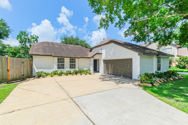 150 Squires Bnd, Stafford, TX 77477 - view of front of home featuring brick siding, a garage, concrete driveway, and a shingled roof
