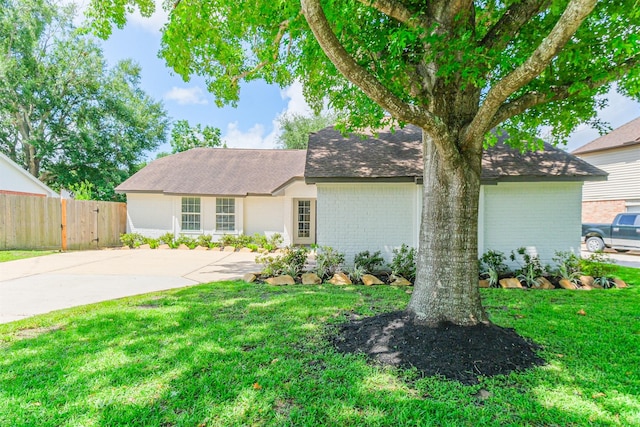 150 Squires Bnd, Stafford, TX 77477 - view of front of property featuring brick siding, roof with shingles, and driveway